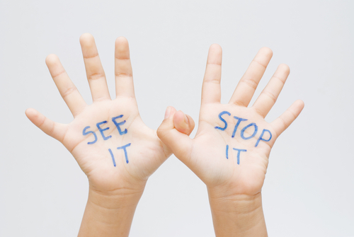 A child’s hands advocating for stopping child abuse in Philadelphia