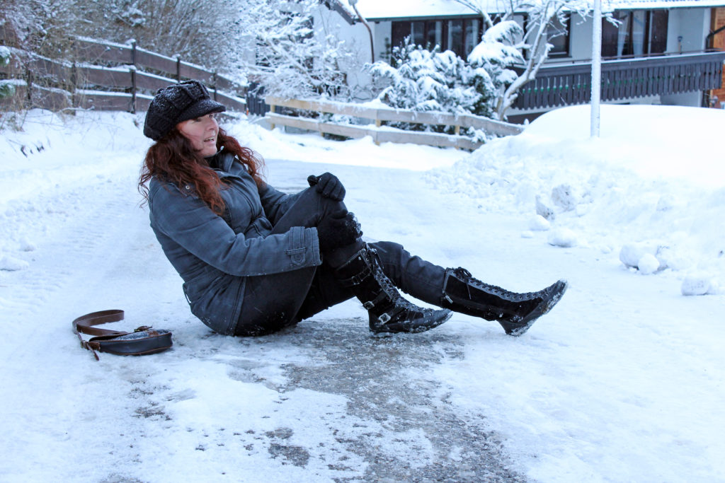 A women experiencing pain after a slip and fall accident on ice in Philadelphia